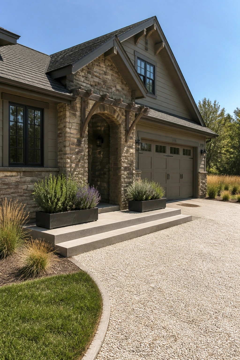 Front exterior of a Craftsman-style house featuring a prominent stone arched entryway, beige siding, a gabled roof, and a two-car garage to the right.